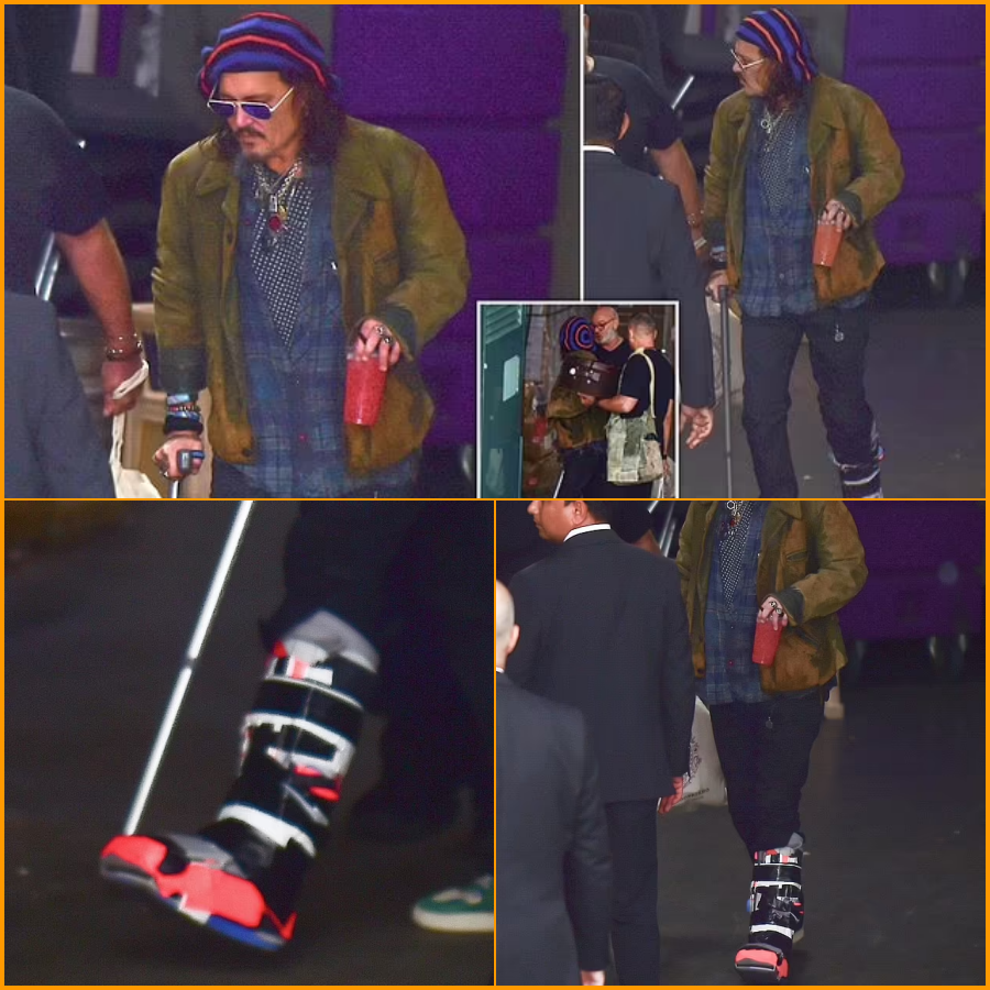 Johnny Depp appears wearing a medical boot and using a cane What